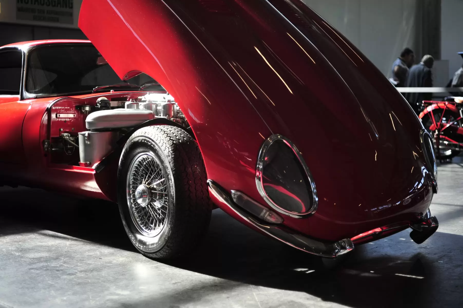 Red Jaguar E Type with front bonnet lifted
